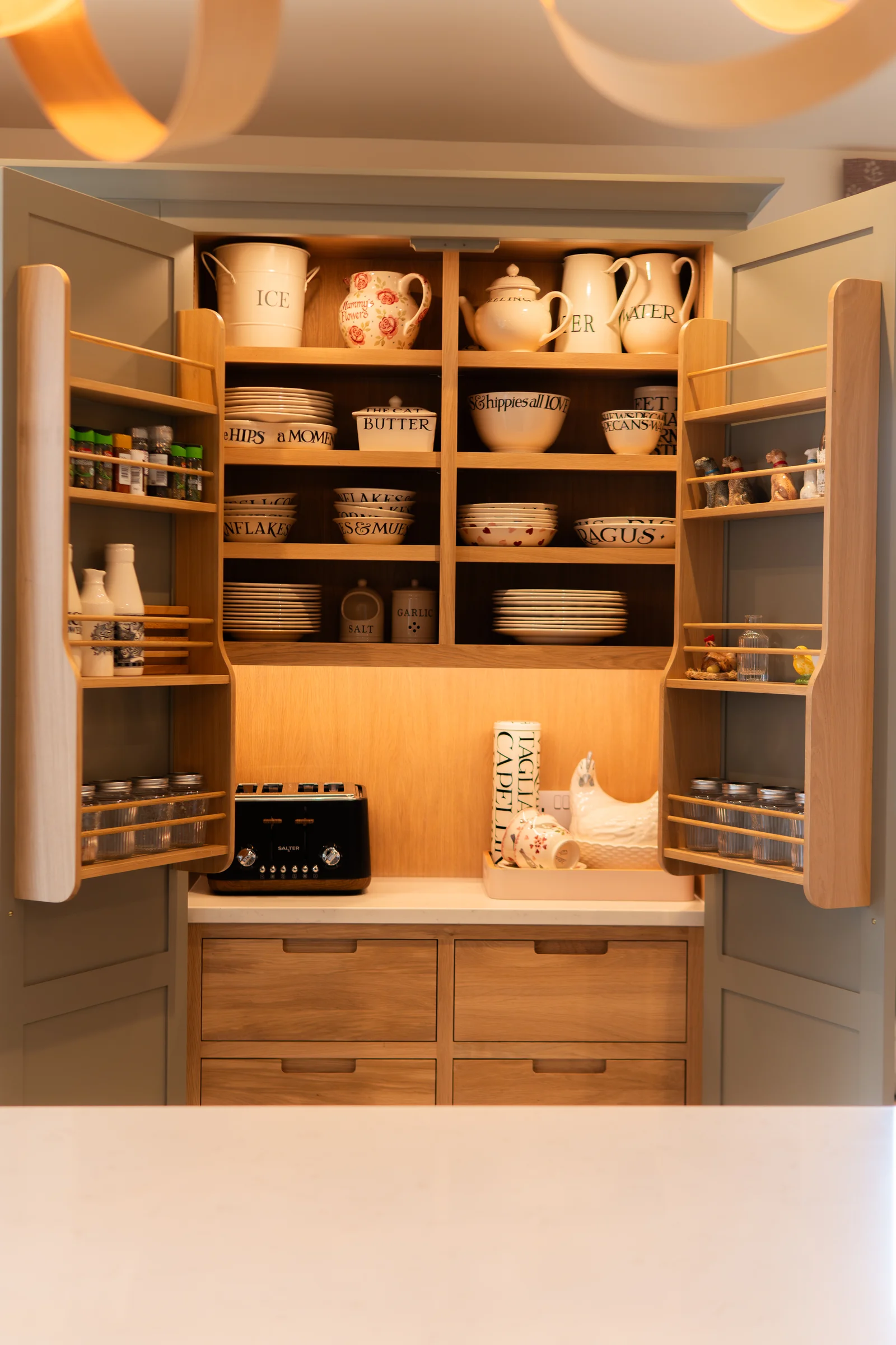 Grey larder pantry open oak shelves spice racks emma bridgewater crockery oak drawers