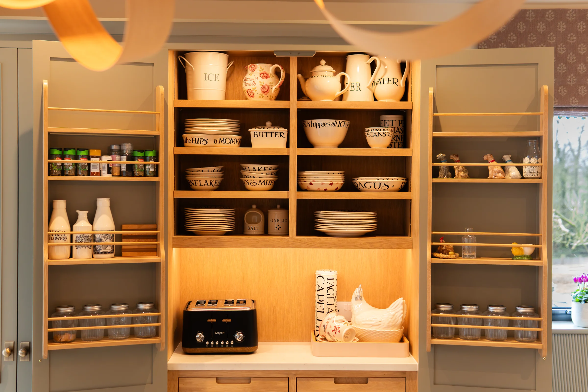 Pantry front on fully open all shelves crockery spice racks both doors oak interior