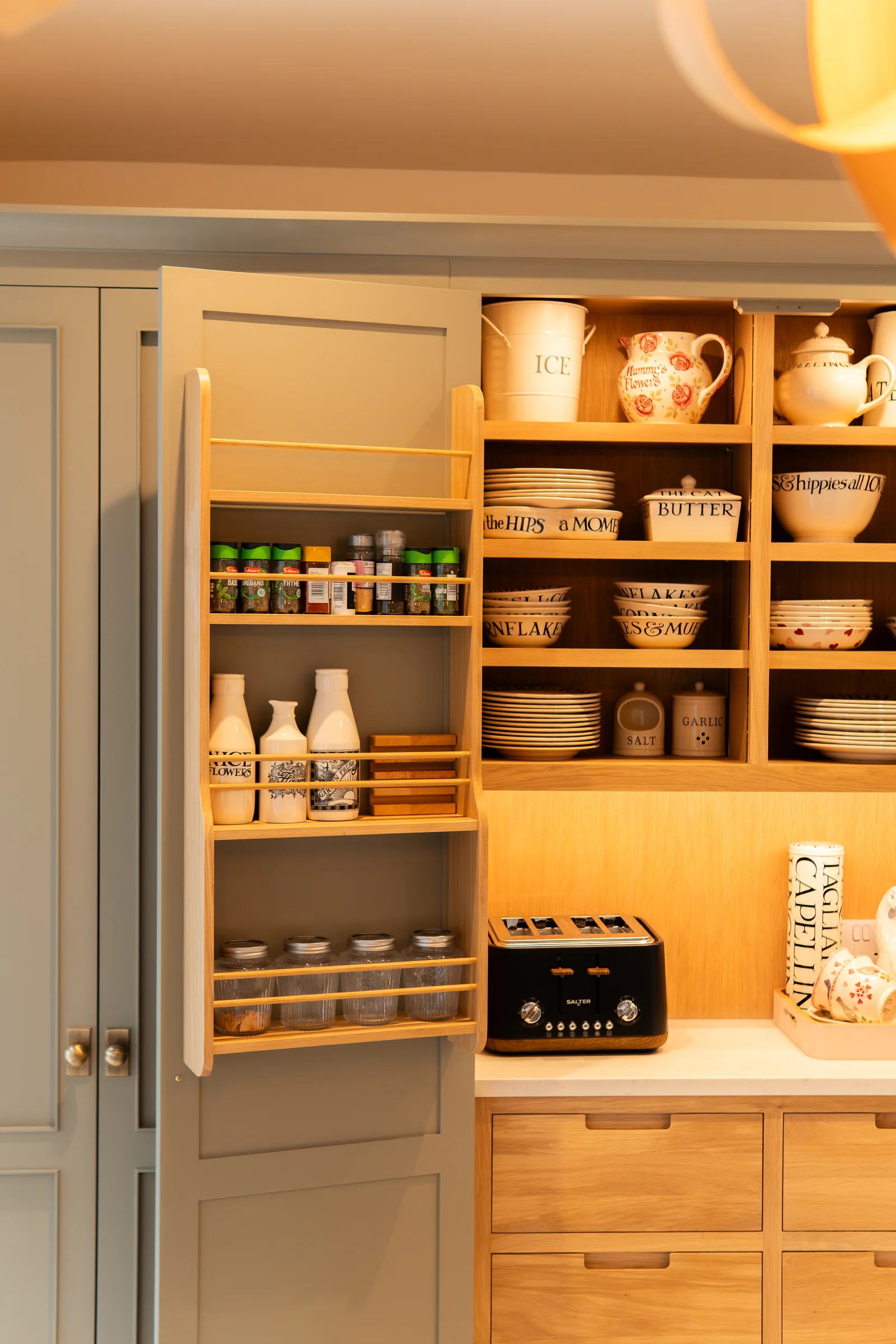 Pantry left side detail spice rack door bottles oak shelves crockery