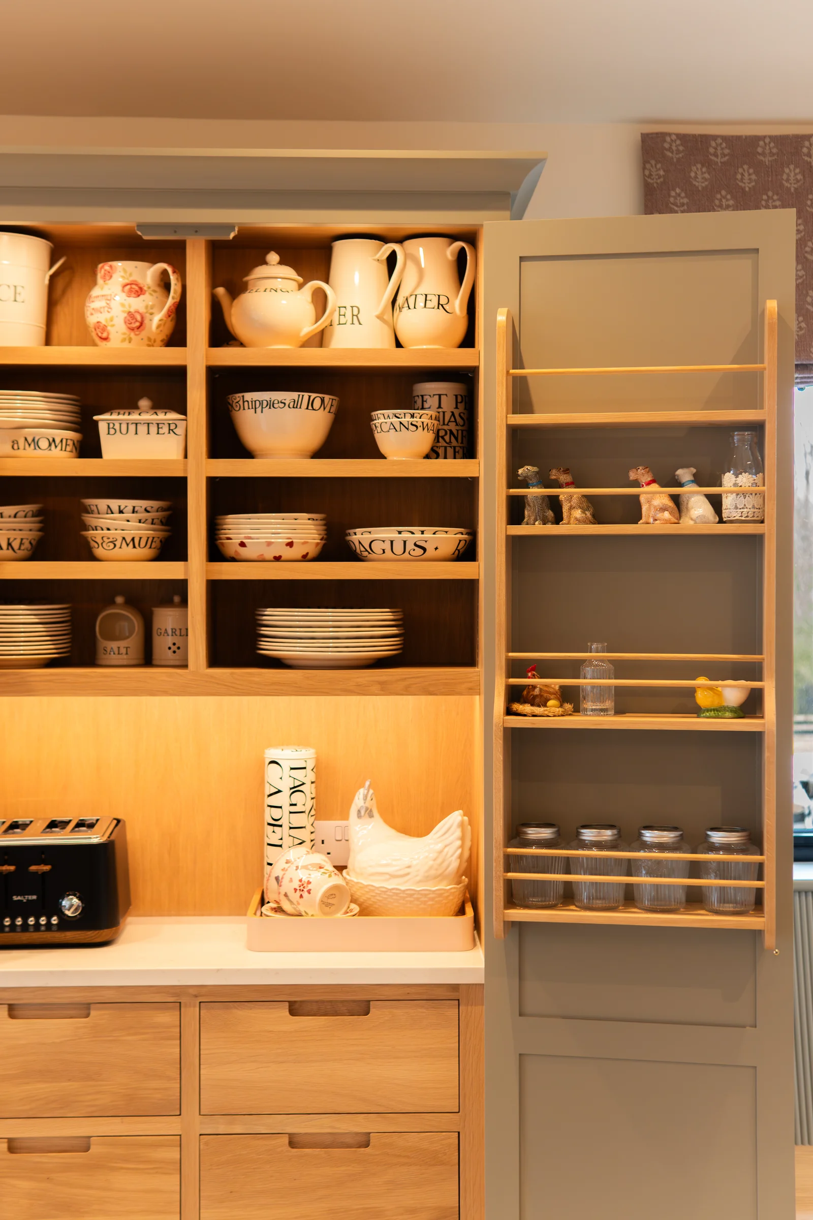 Pantry right side detail crockery shelves spice rack door jars