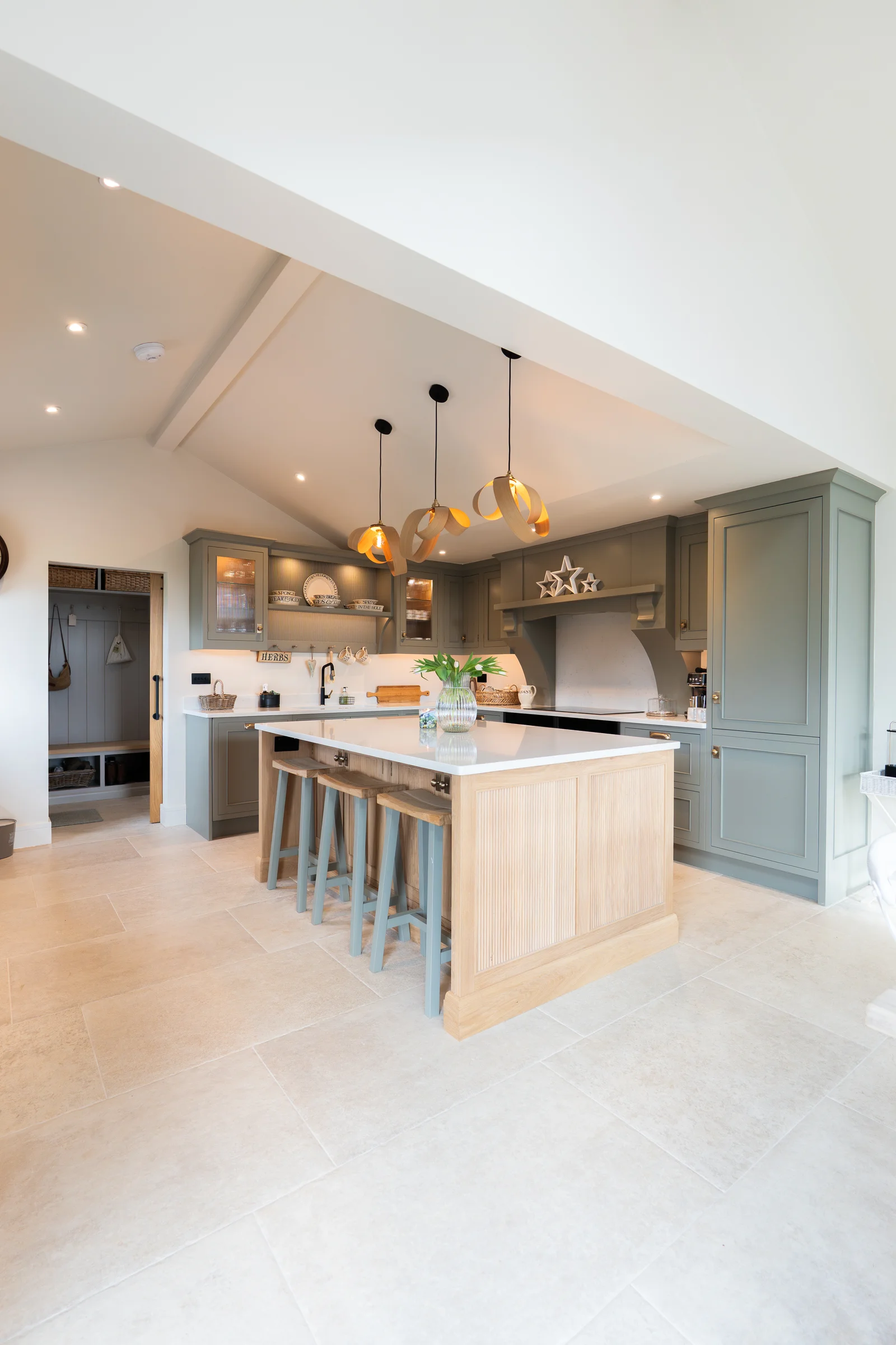 Portrait vaulted kitchen alt oak island stools pendants grey units boot room