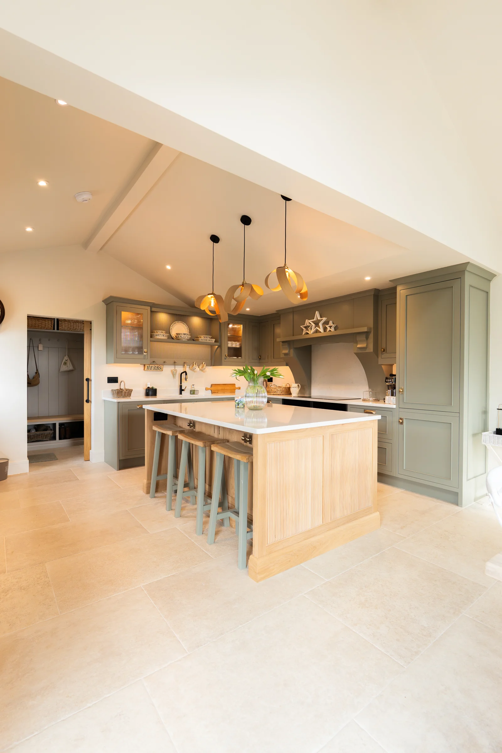 Portrait vaulted kitchen oak island stools ribbon pendants grey units boot room stone