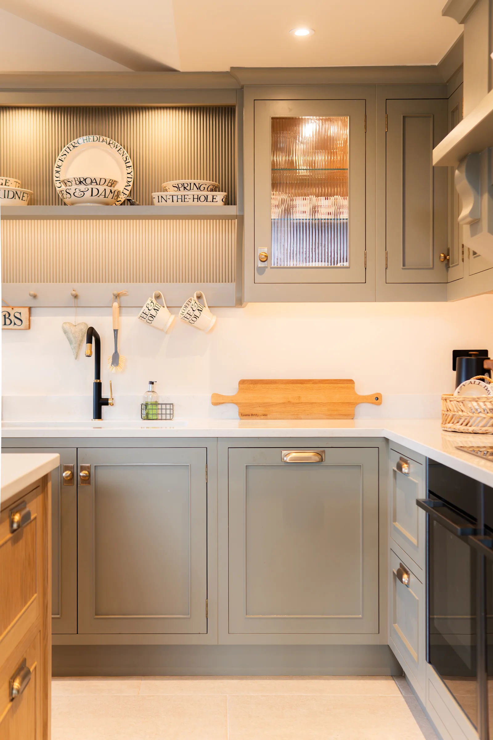 Utility corner grey shaker units black tap reeded glass cabinet emma bridgewater plates brass