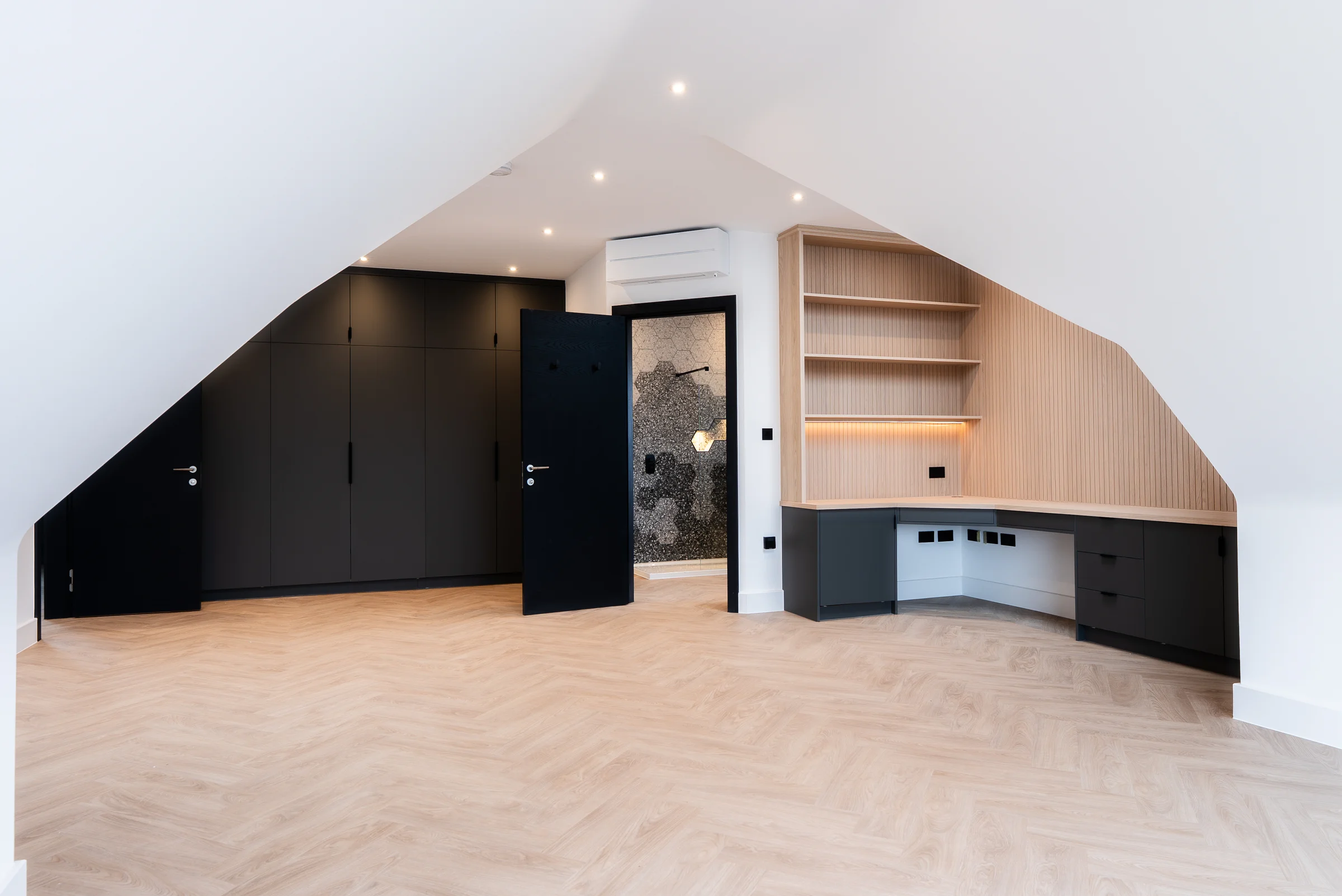 Loft bedroom black wardrobes oak slat desk shelves led strip ensuite door