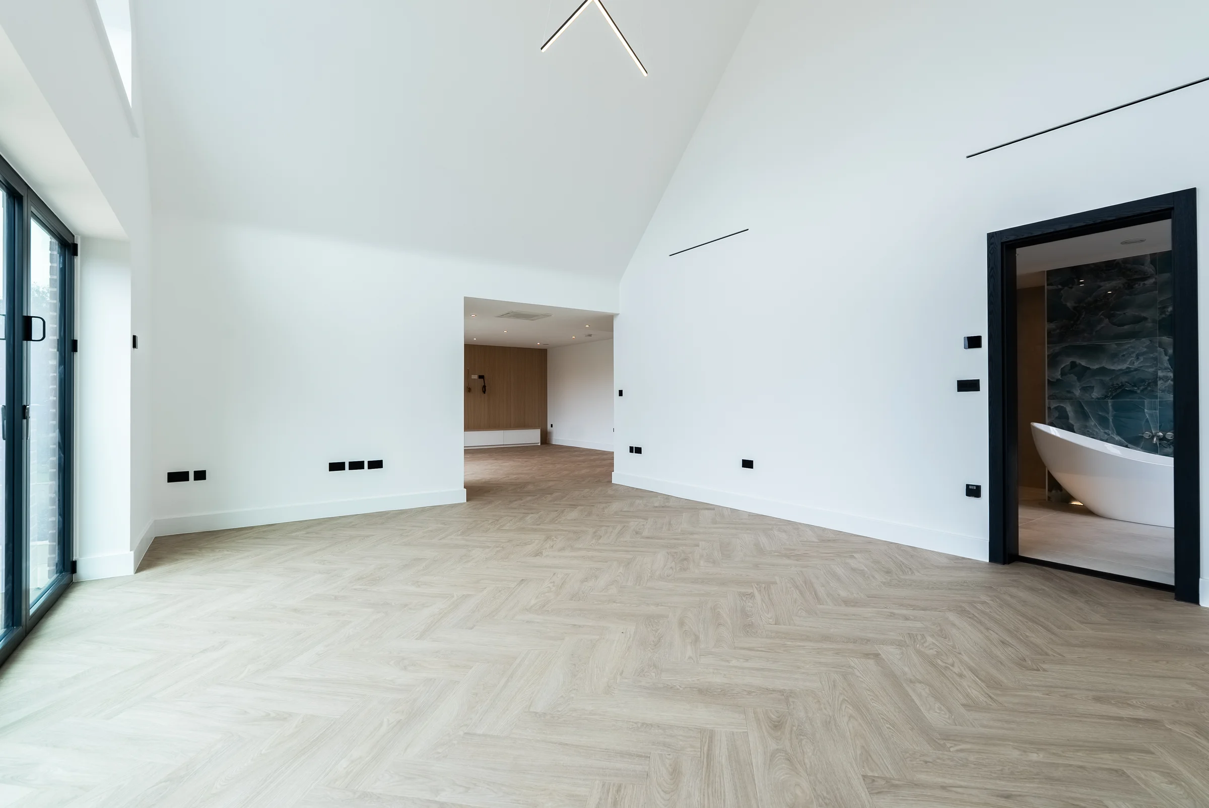 Master suite vaulted dressing area ensuite freestanding bath visible herringbone