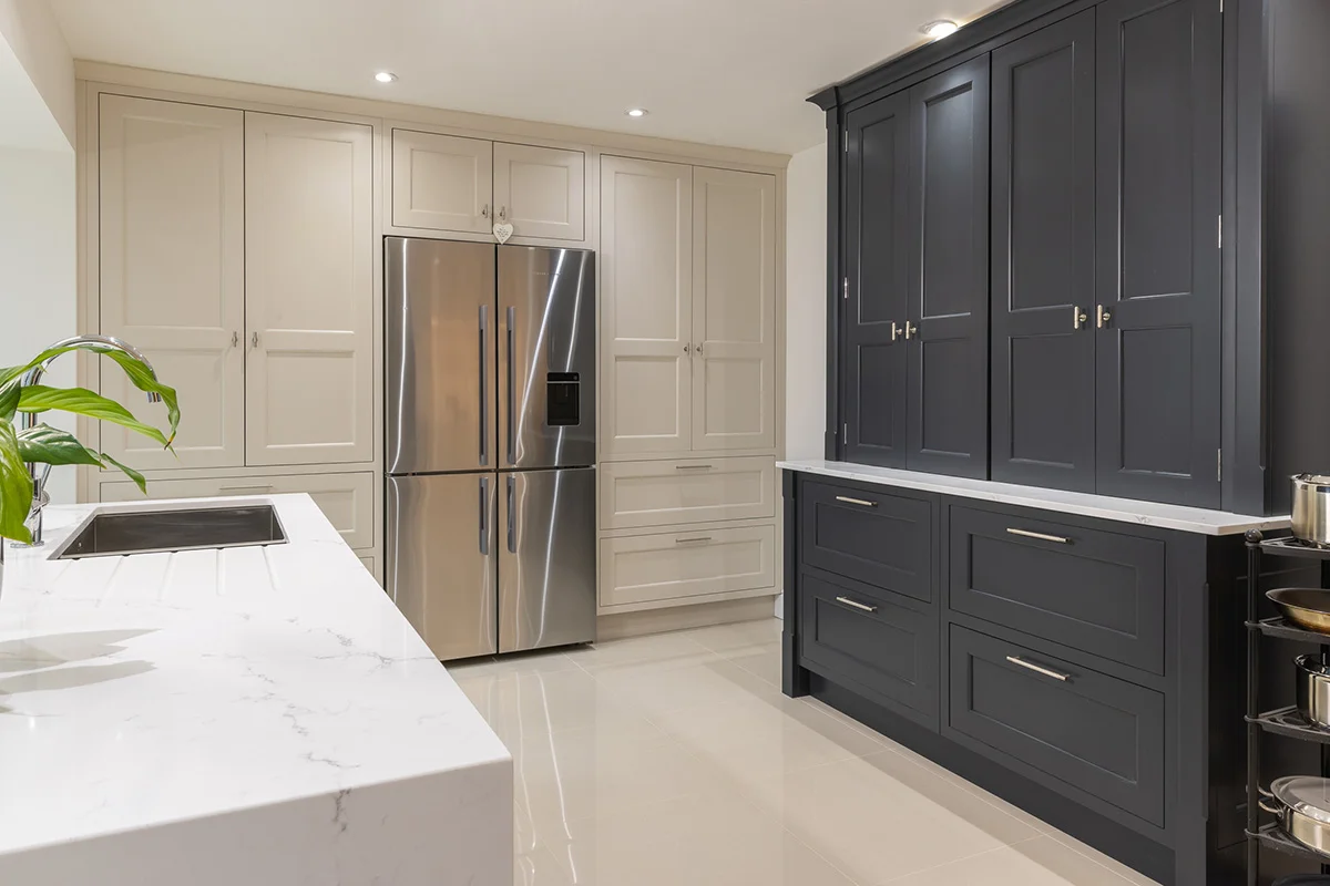 Cream shaker tall units american fridge dark blue larder quartz island