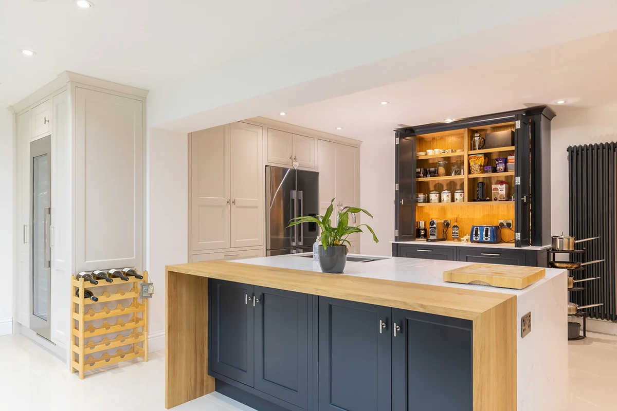 Dark blue island oak end cream tall units pantry open wine rack