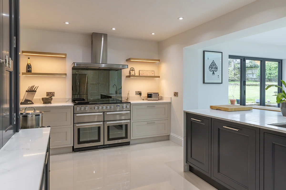 Range cooker mirrored splashback grey blue shaker bifold doors garden