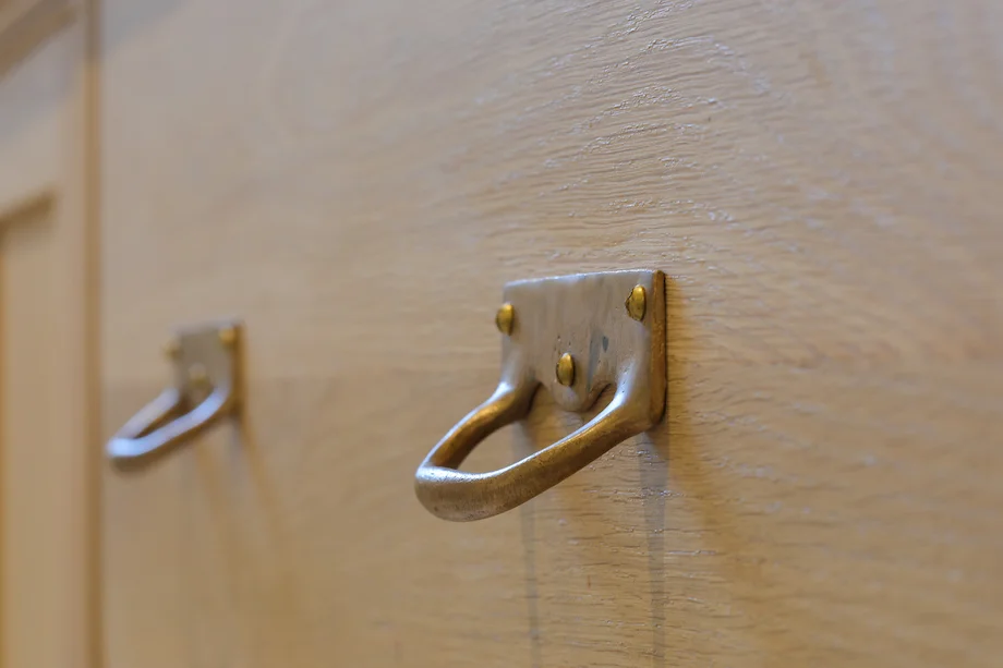 Brass drop handle closeup oak drawer grain detail