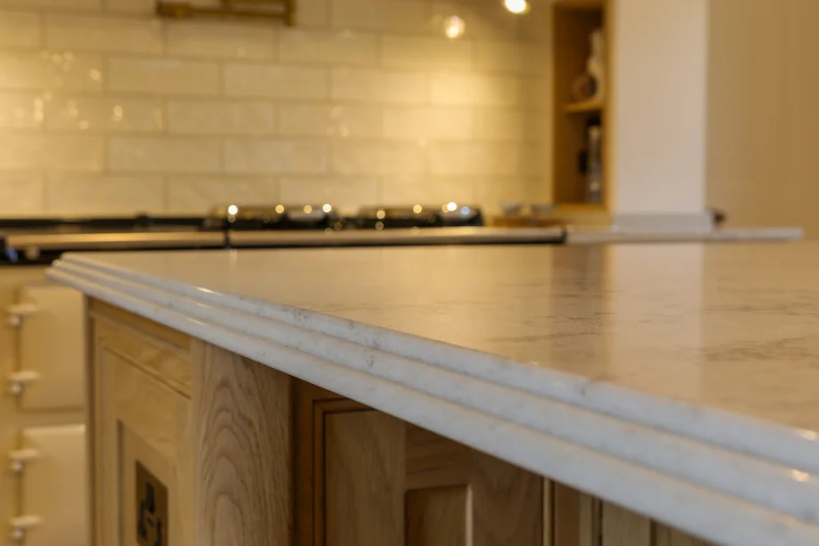 Marble worktop profiled edge detail oak island closeup