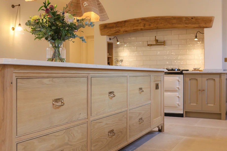 Oak island drawers brass handles aga behind flowers