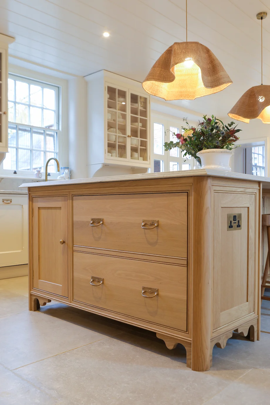 Oak island end view large drawers brass drop handles rattan pendants