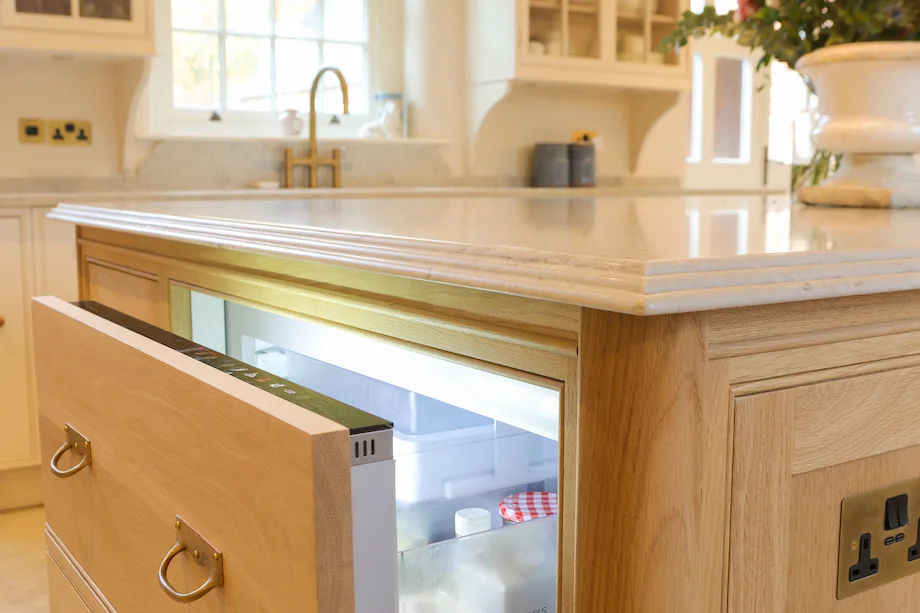 Oak island integrated fridge drawer open marble top brass handles