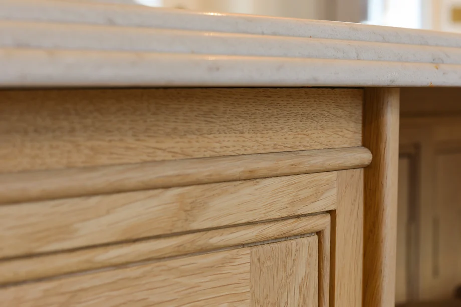 Oak panel detail marble profiled edge meeting oak closeup