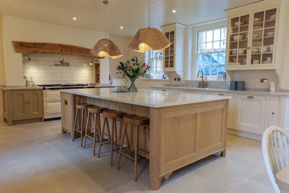 Wide oak island bar stools cream aga beam glazed cabinets rattan pendants