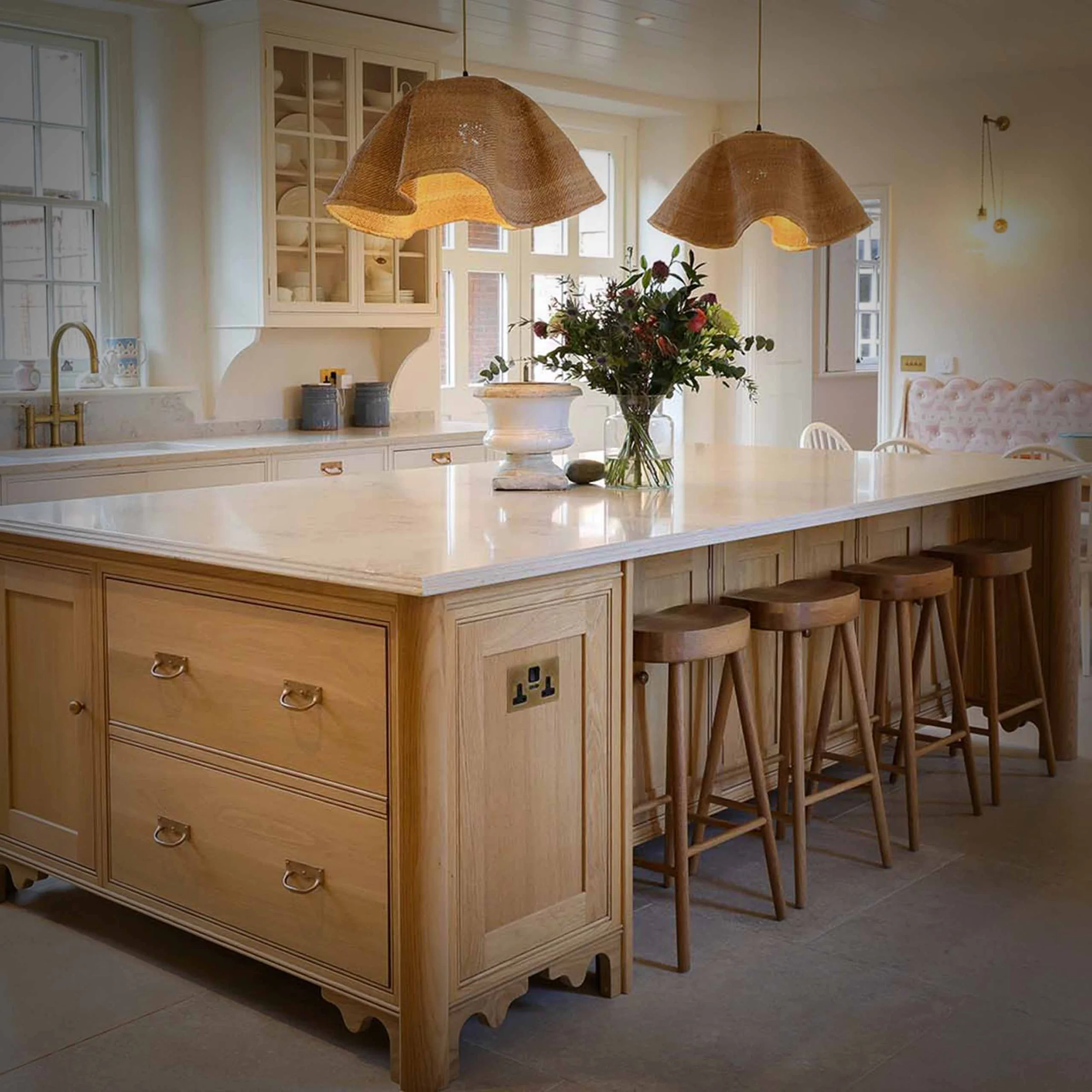 Oak island marble worktop rattan pendants bar stools cream units country kitchen