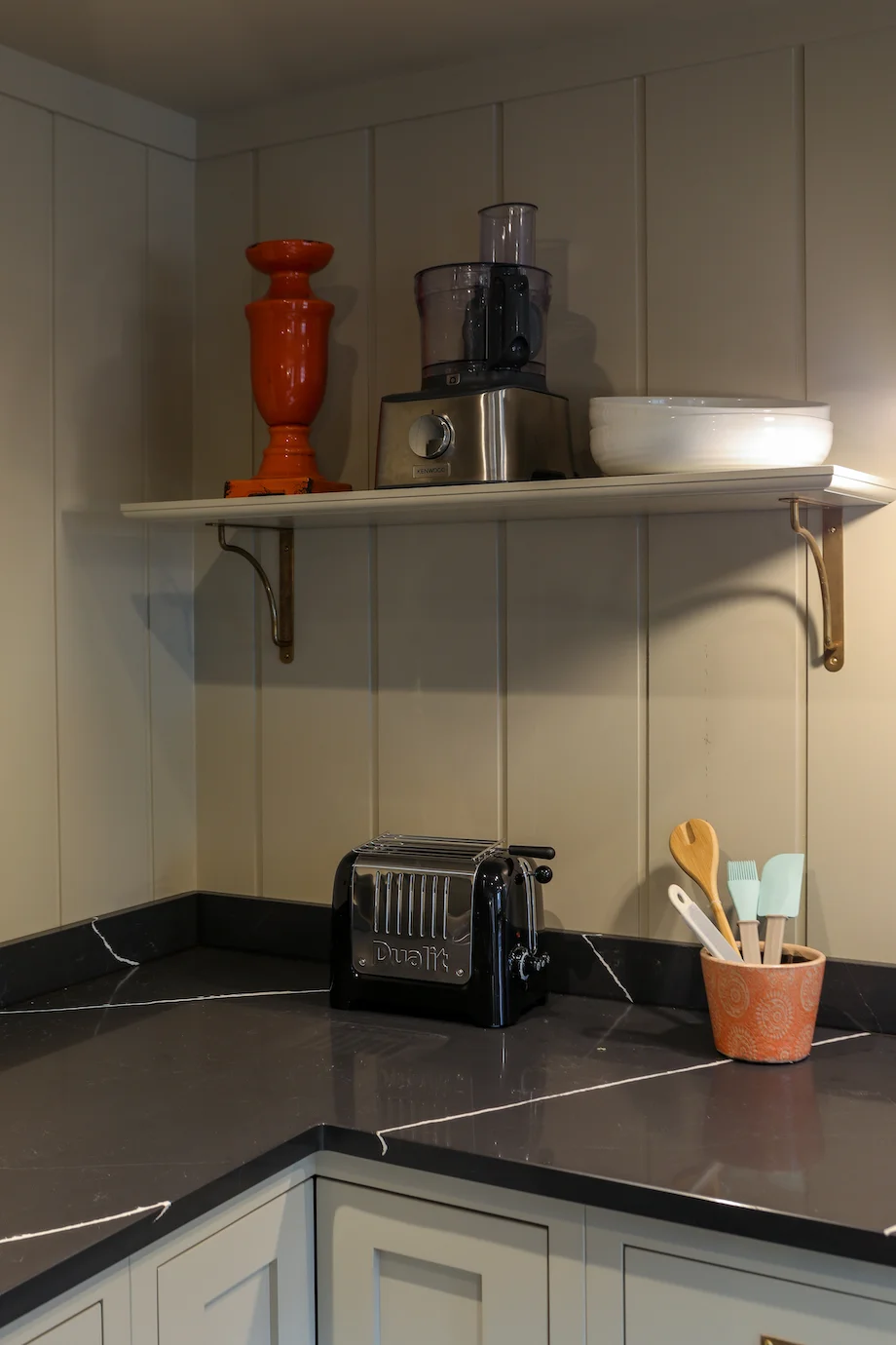 Corner shelf appliances toaster food processor dark quartz panelling brass brackets