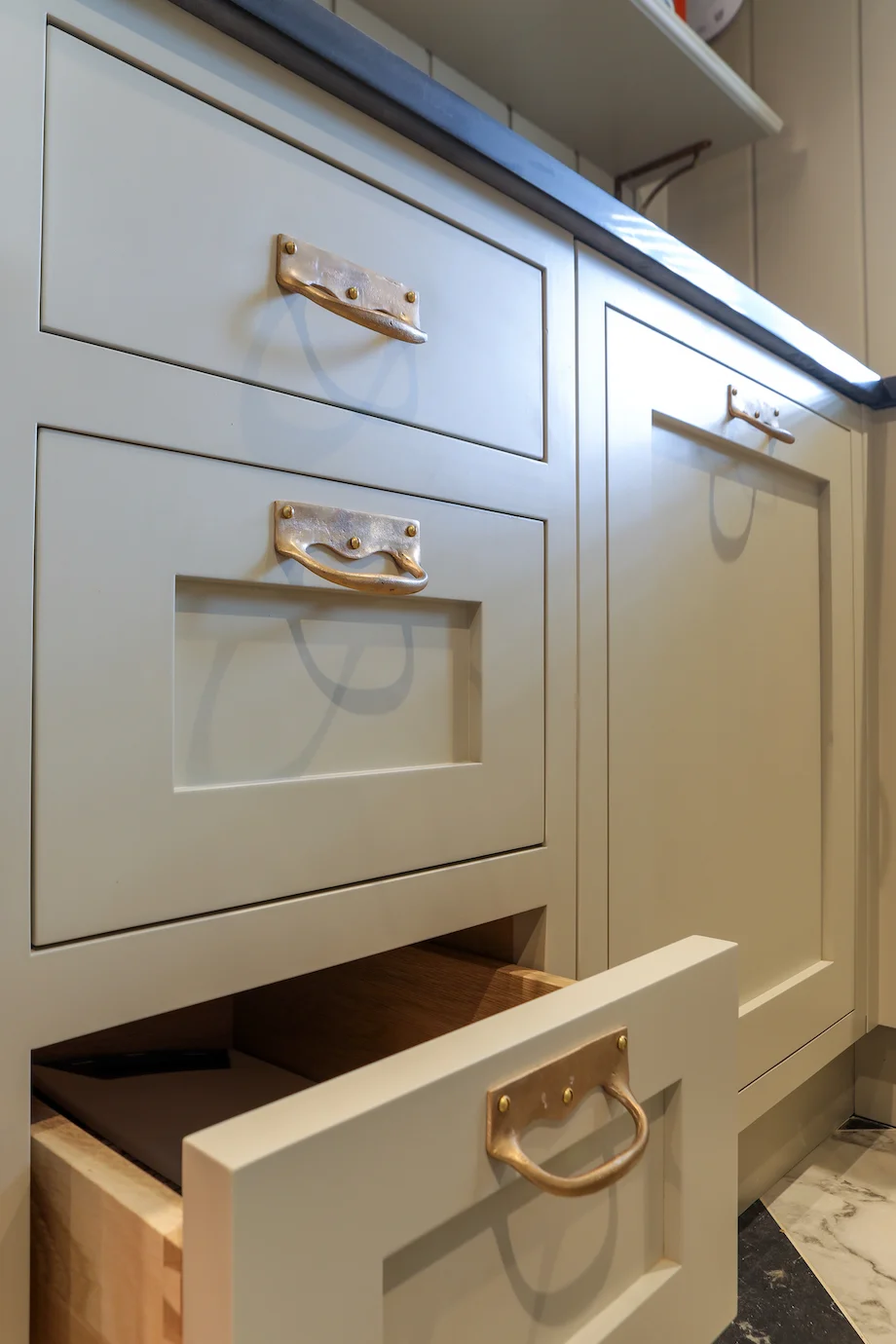 Grey drawers oak dovetailed drawer open brass handles craftsmanship detail