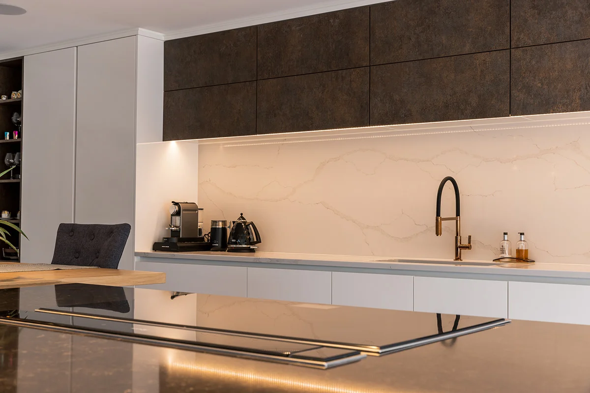 Dark oxide wall units marble splashback led strip brass black tap induction