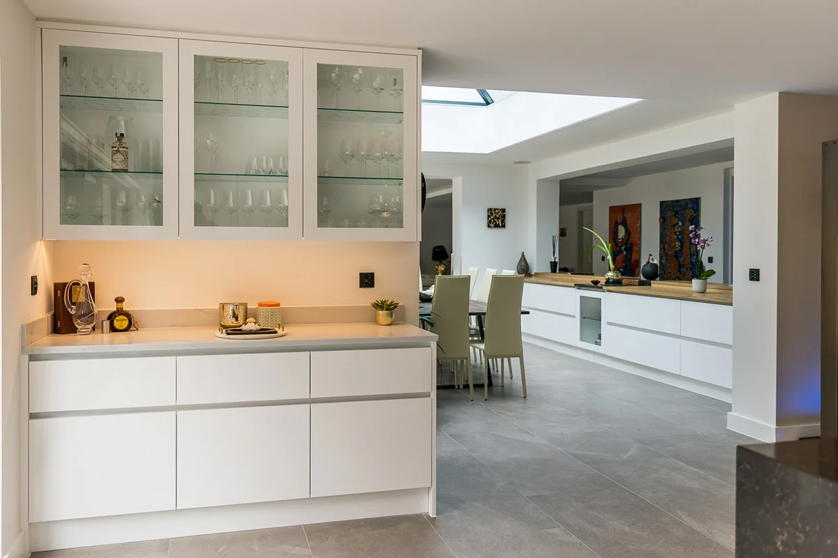 Dresser glass cabinets dining area skylight white sideboard oak top staircase