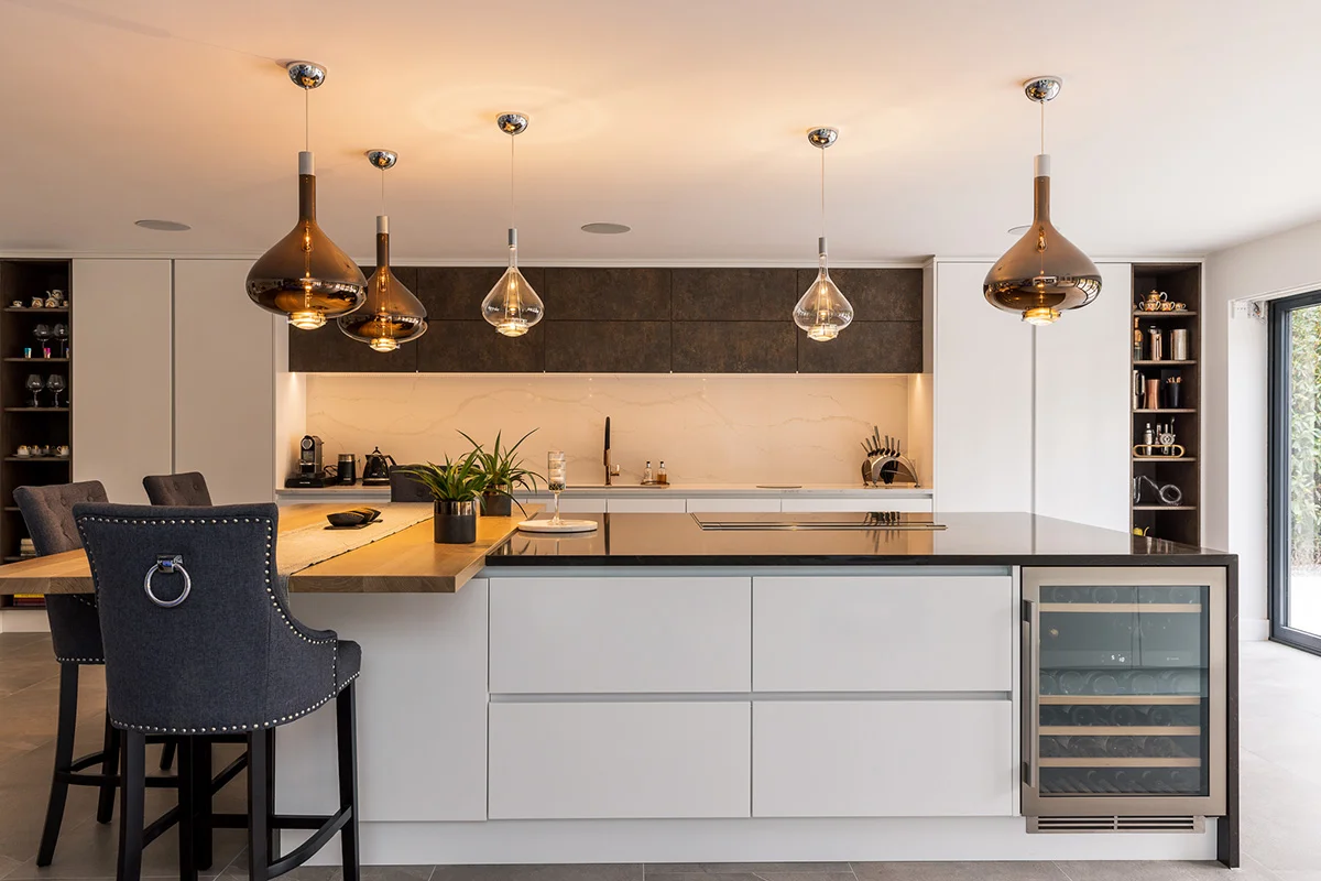 Full kitchen white handleless island wine cooler oxide wall units copper pendants
