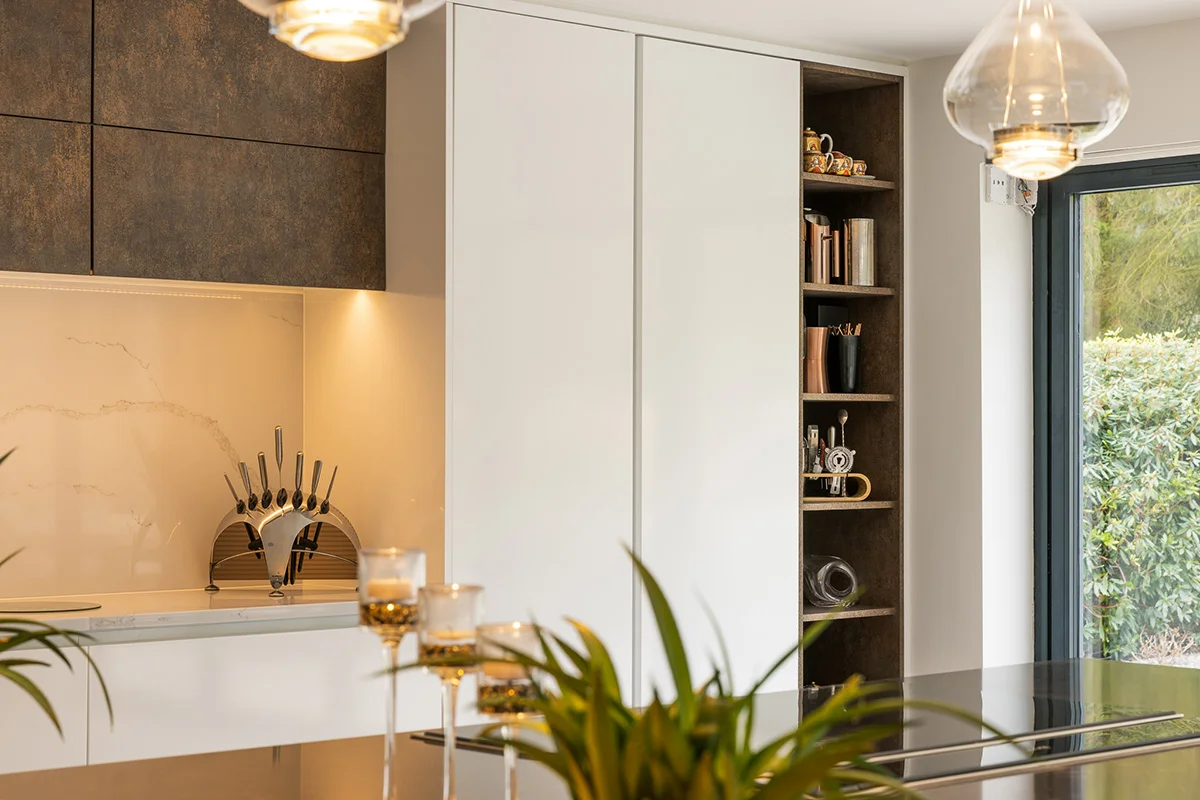 White tall units dark oxide open shelving niche glass pendant marble splashback