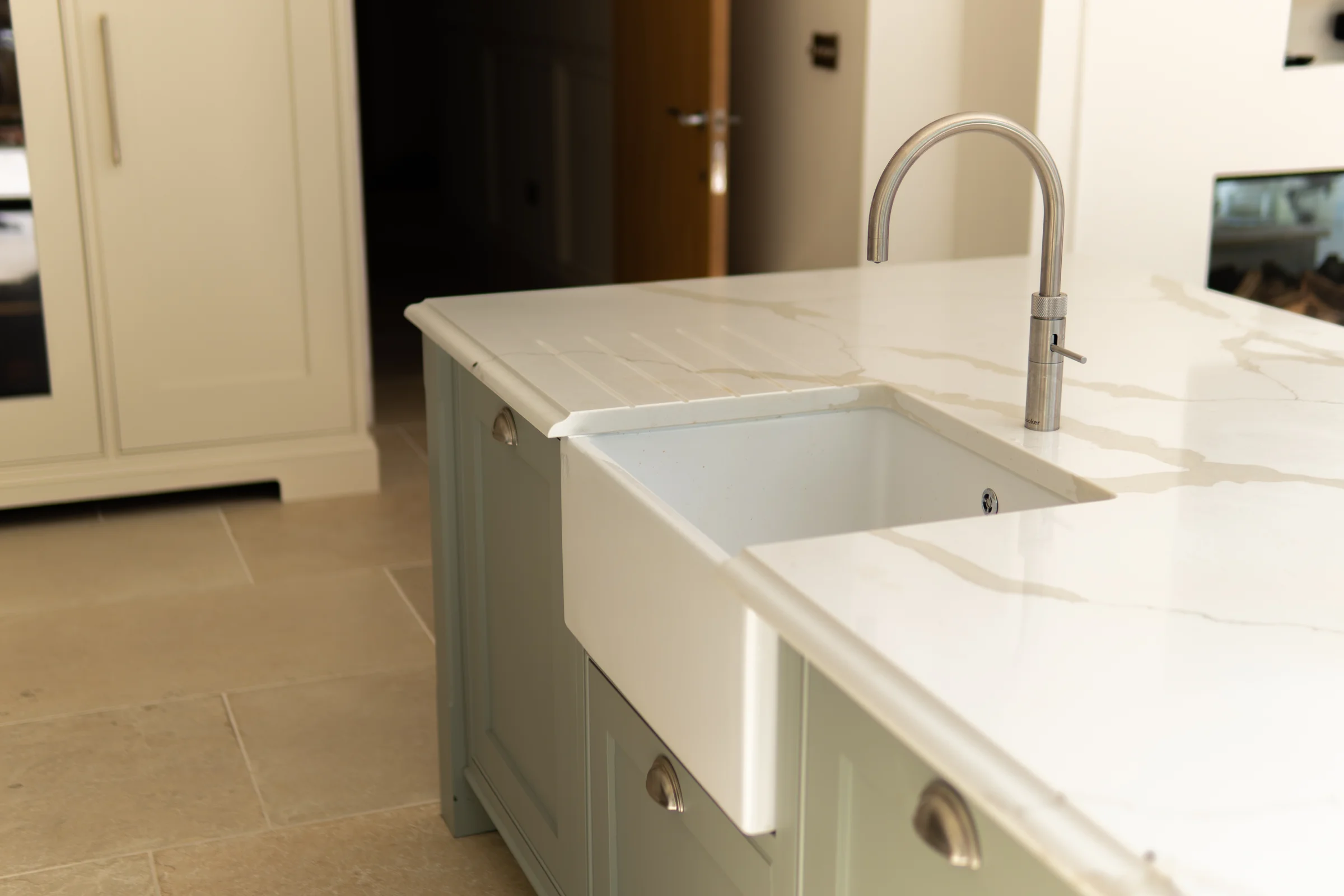 Belfast sink sage island nickel tap quartz drainer grooves limestone floor