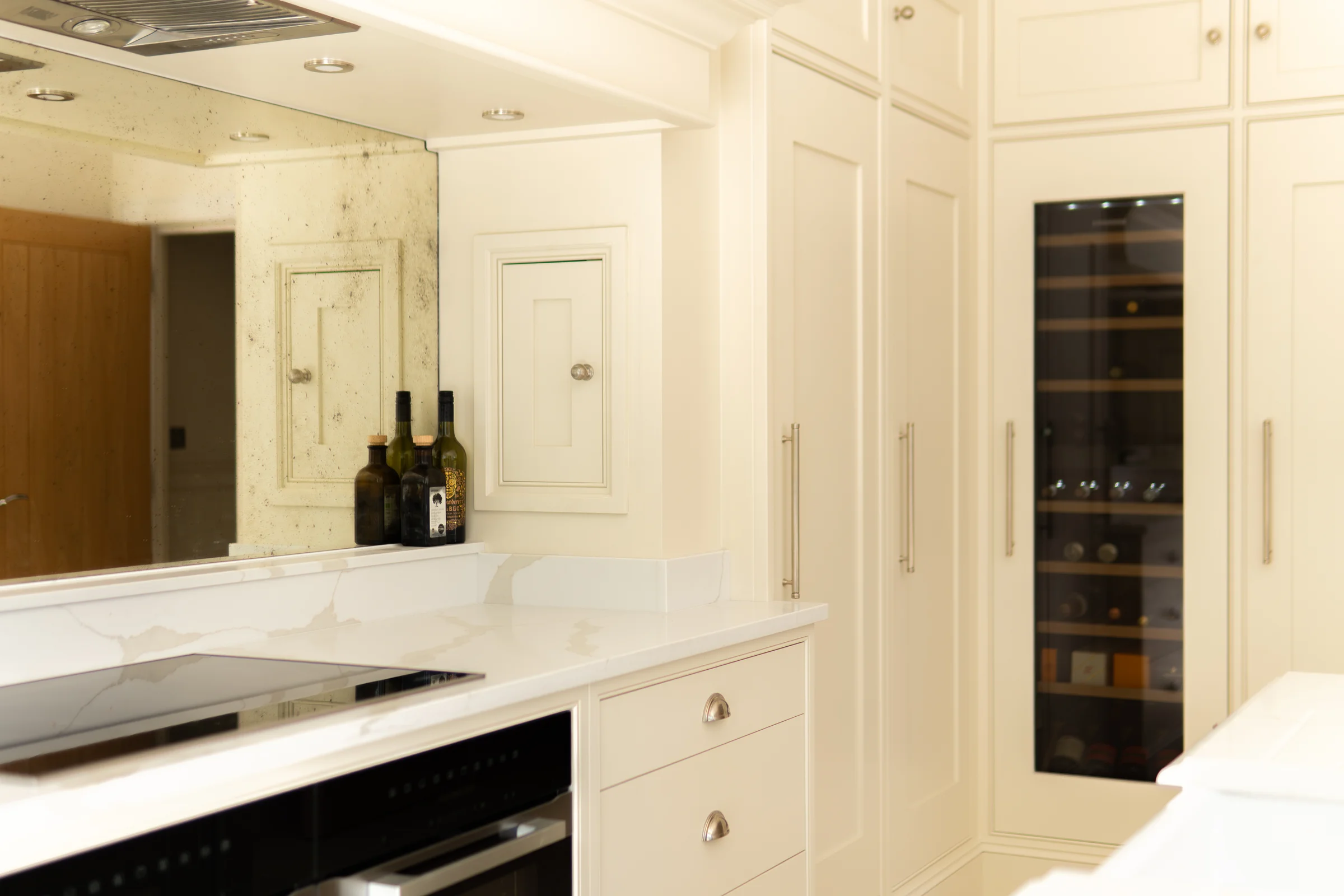 Cooking run tall units induction hob antiqued mirror wine cooler bar handles cornice