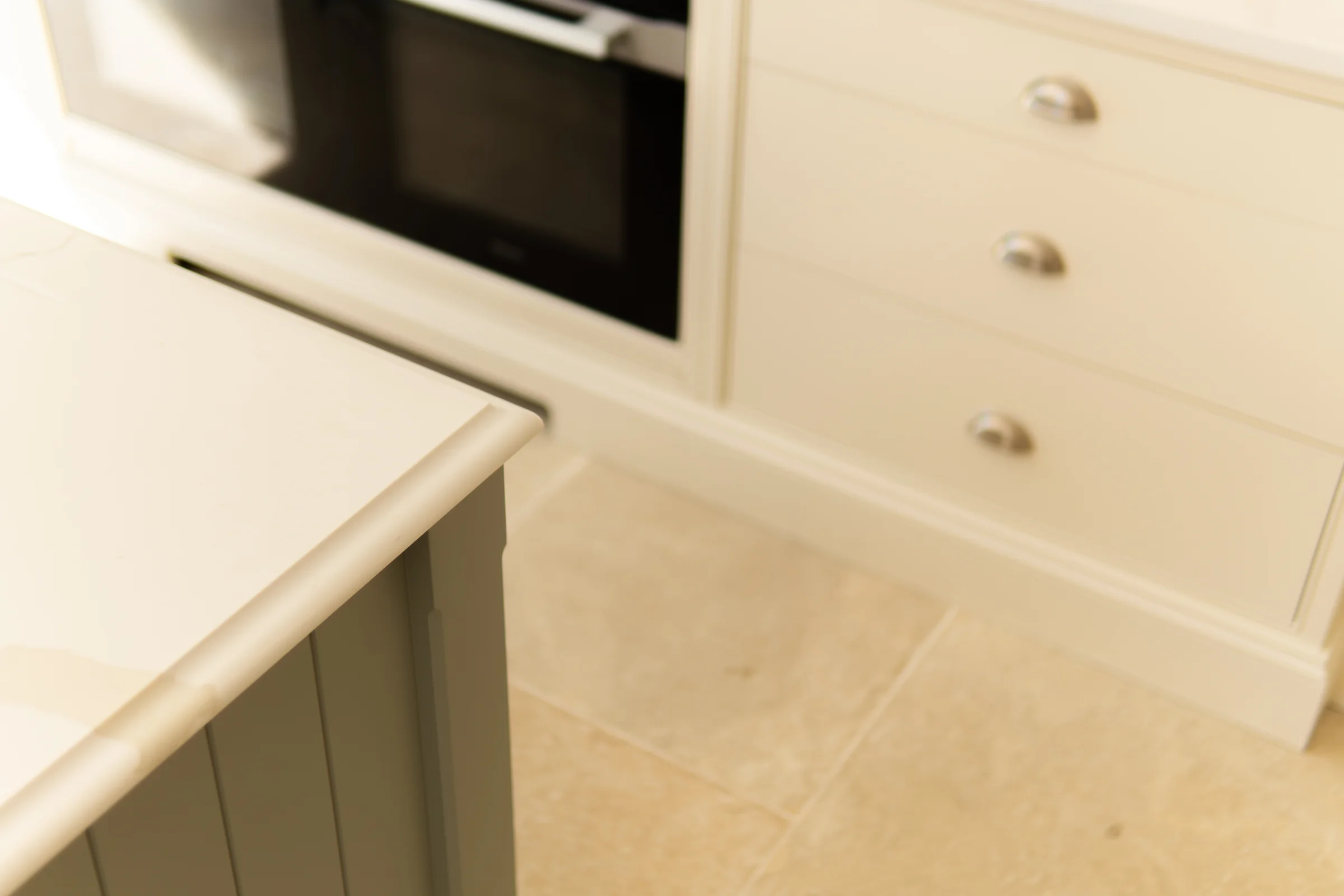 Sage island corner quartz edge profile cream drawers cup handles oven limestone
