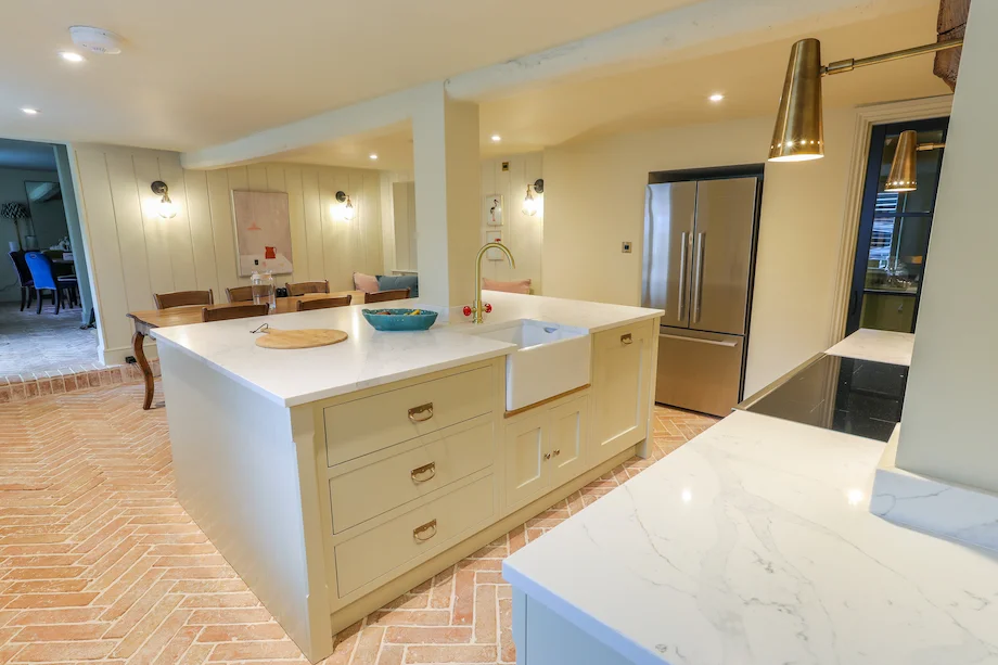 Wide view cream island belfast sink fridge freezer brass wall light beam dining