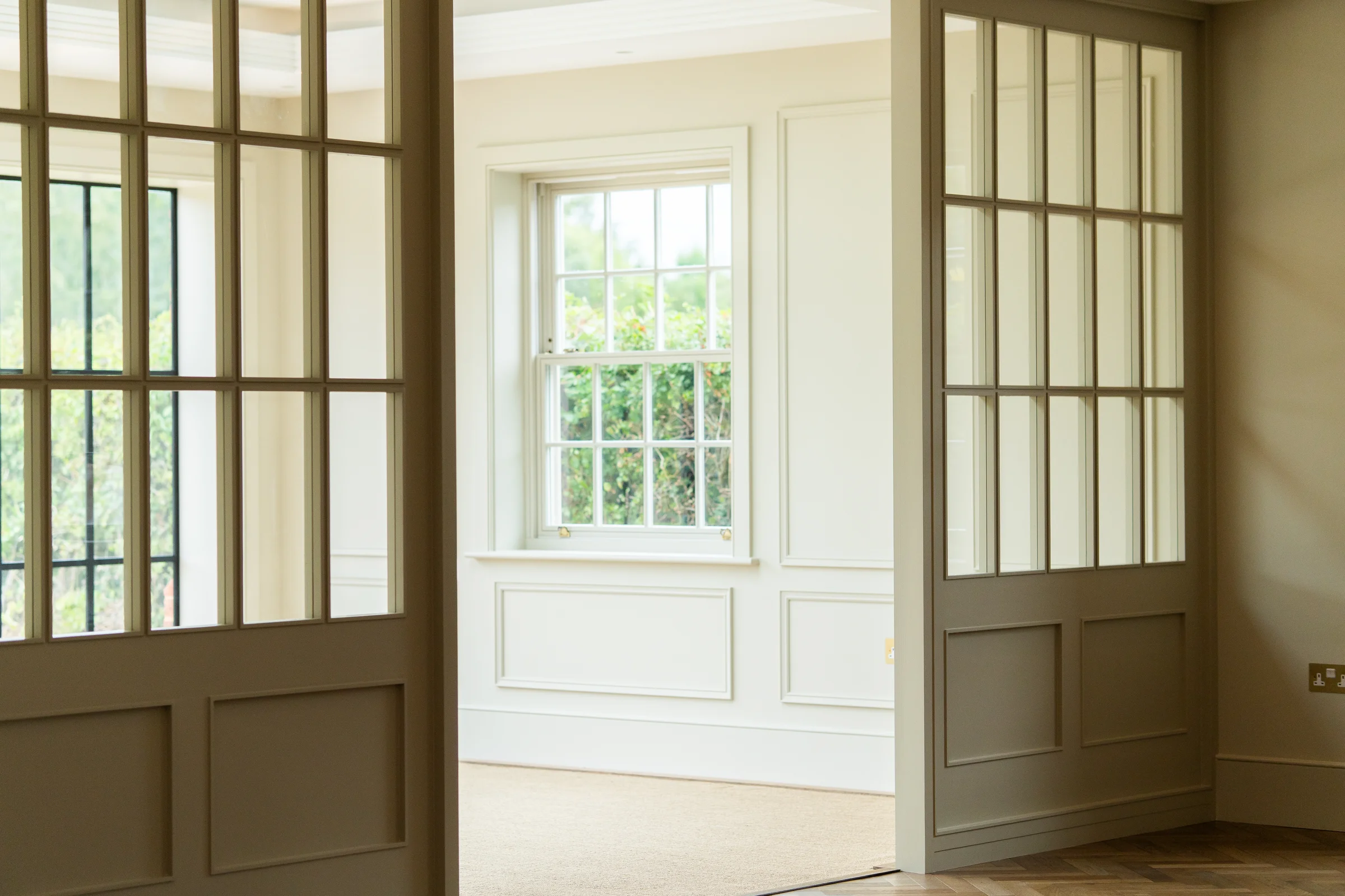 Crittall internal glazed doors olive taupe frames sash window wall panelling