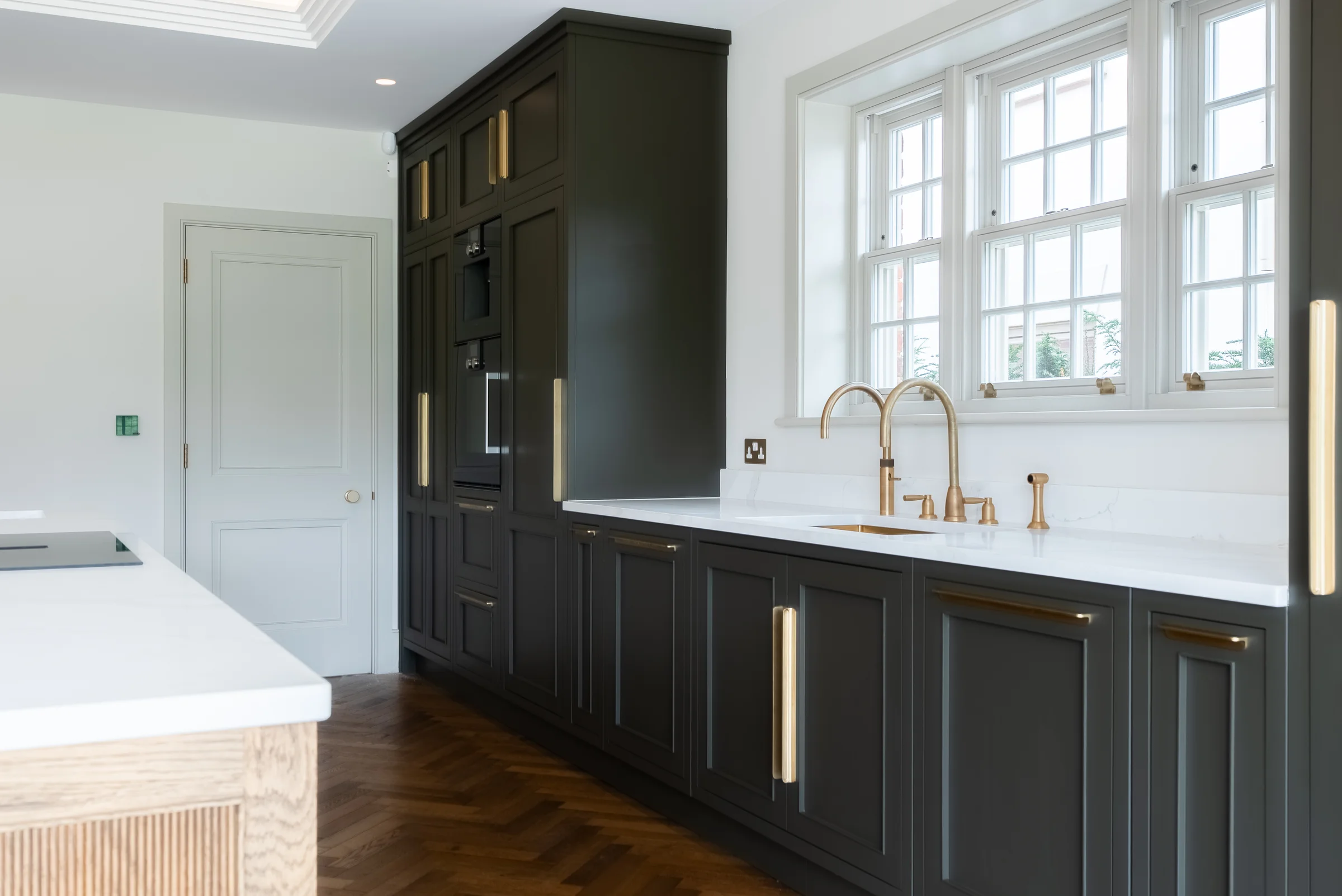 Sink run dark charcoal shaker brass handles dual taps quartz marble upstand casement