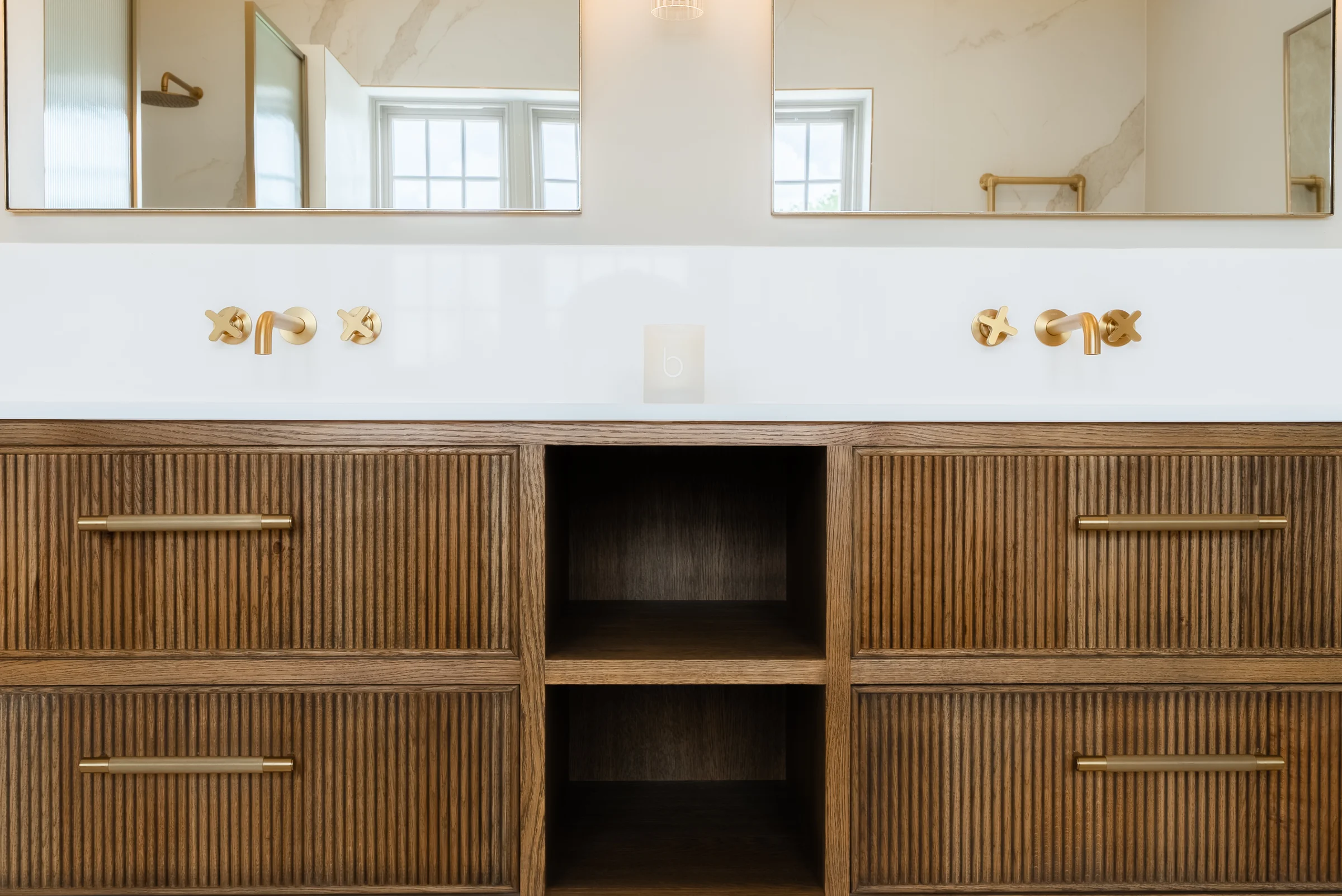 Vanity closeup dark oak reeded drawers brass cross head taps handles mirrors