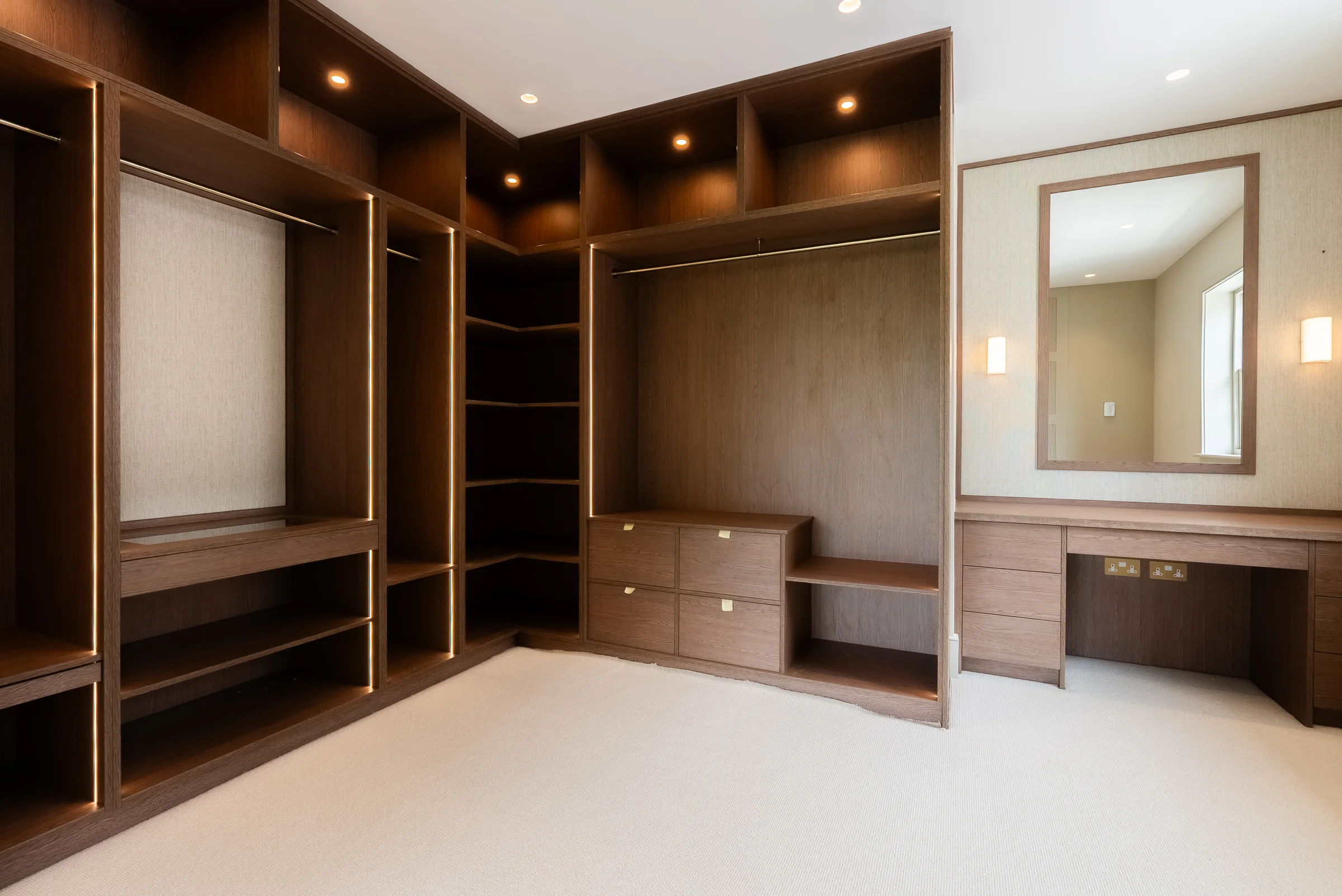 Walk in dressing room dark oak wardrobe hanging rails shelves drawers led mirror