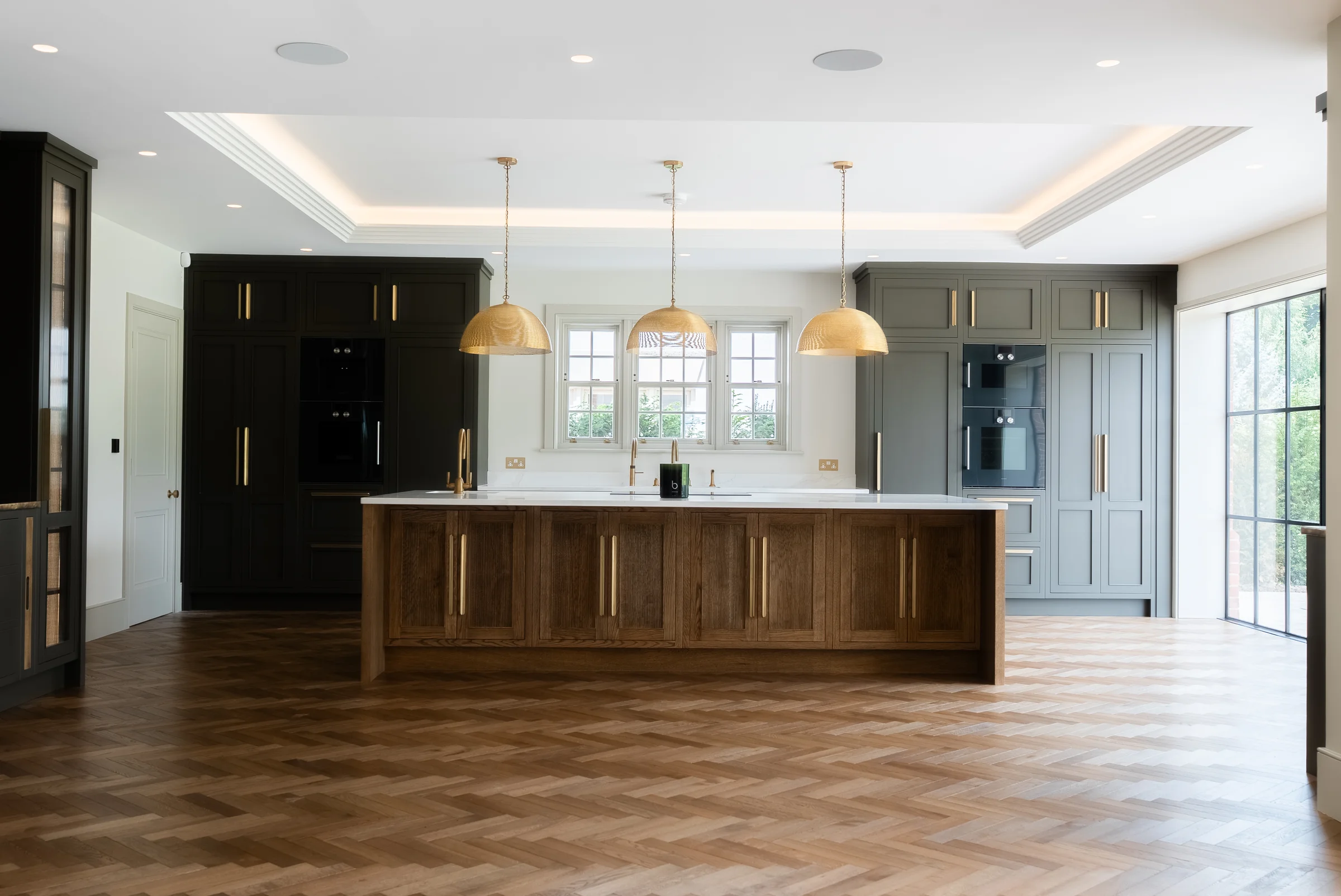 Full kitchen dark oak island brass handles dome pendants charcoal units coffered ceiling herringbone