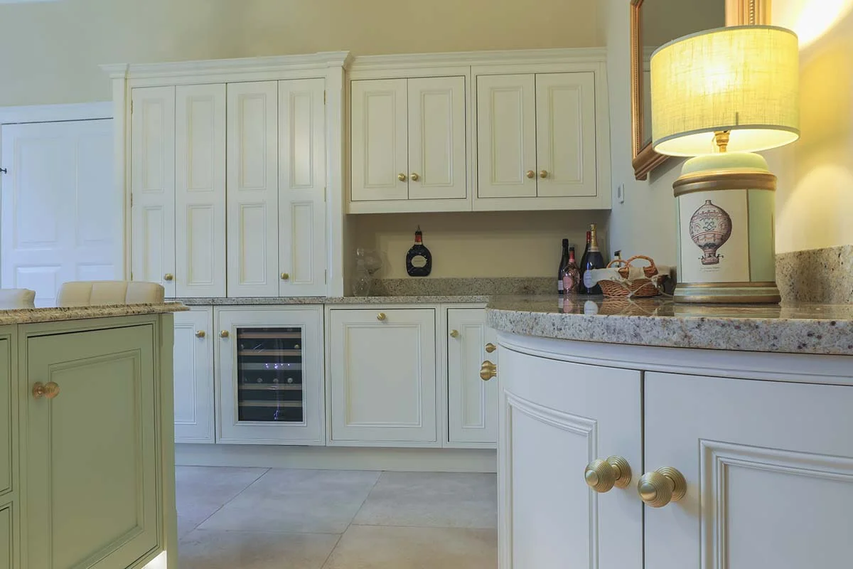 Cream wall units wine cooler curved end unit lamp granite brass knobs