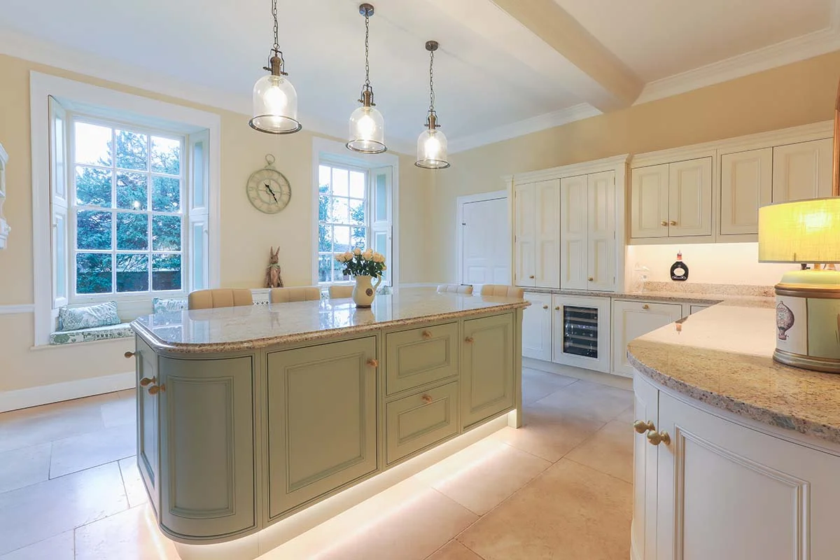 Full kitchen duck egg island led plinth cream units bell pendants vaulted ceiling