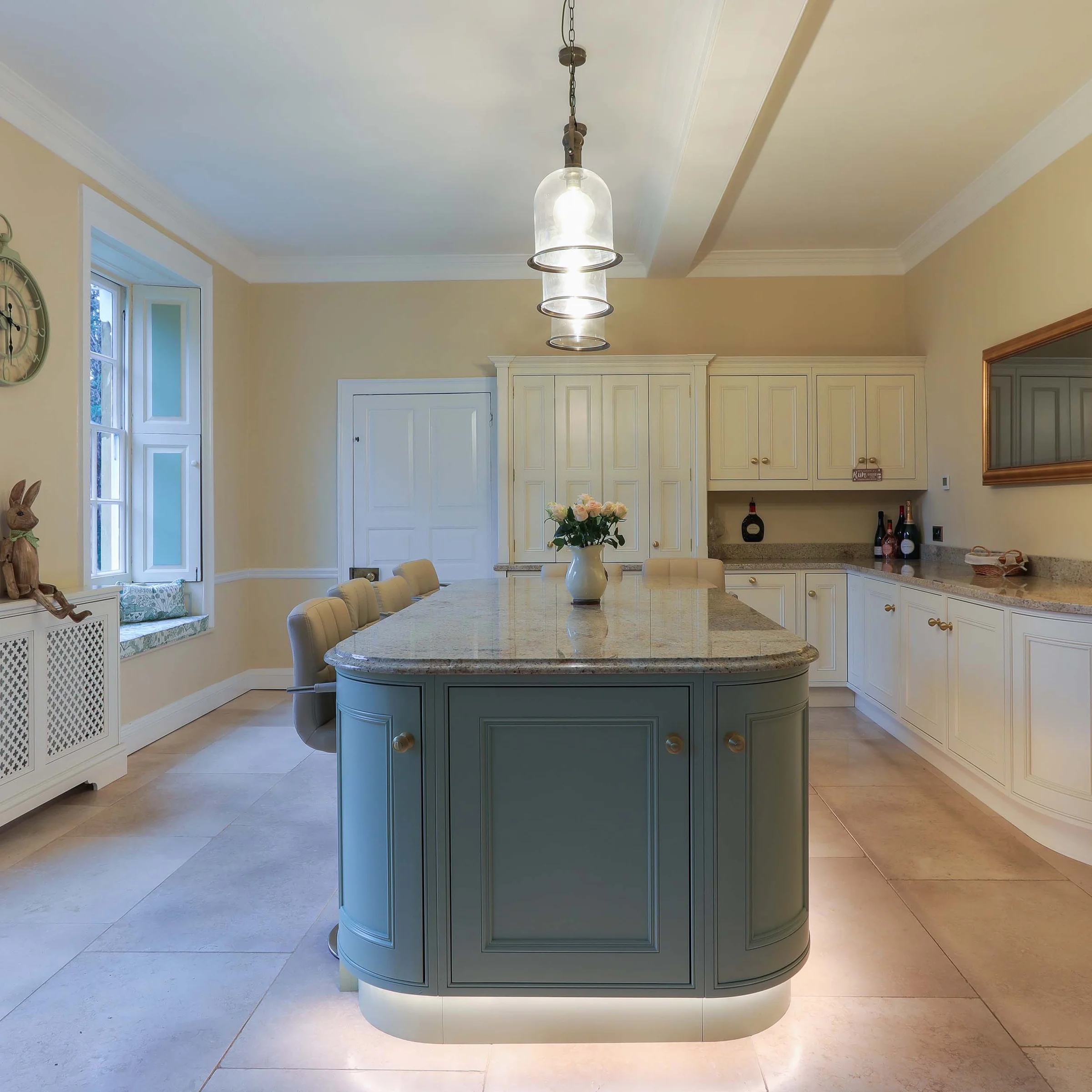 Duck egg blue curved island granite worktop cream traditional units bell pendants