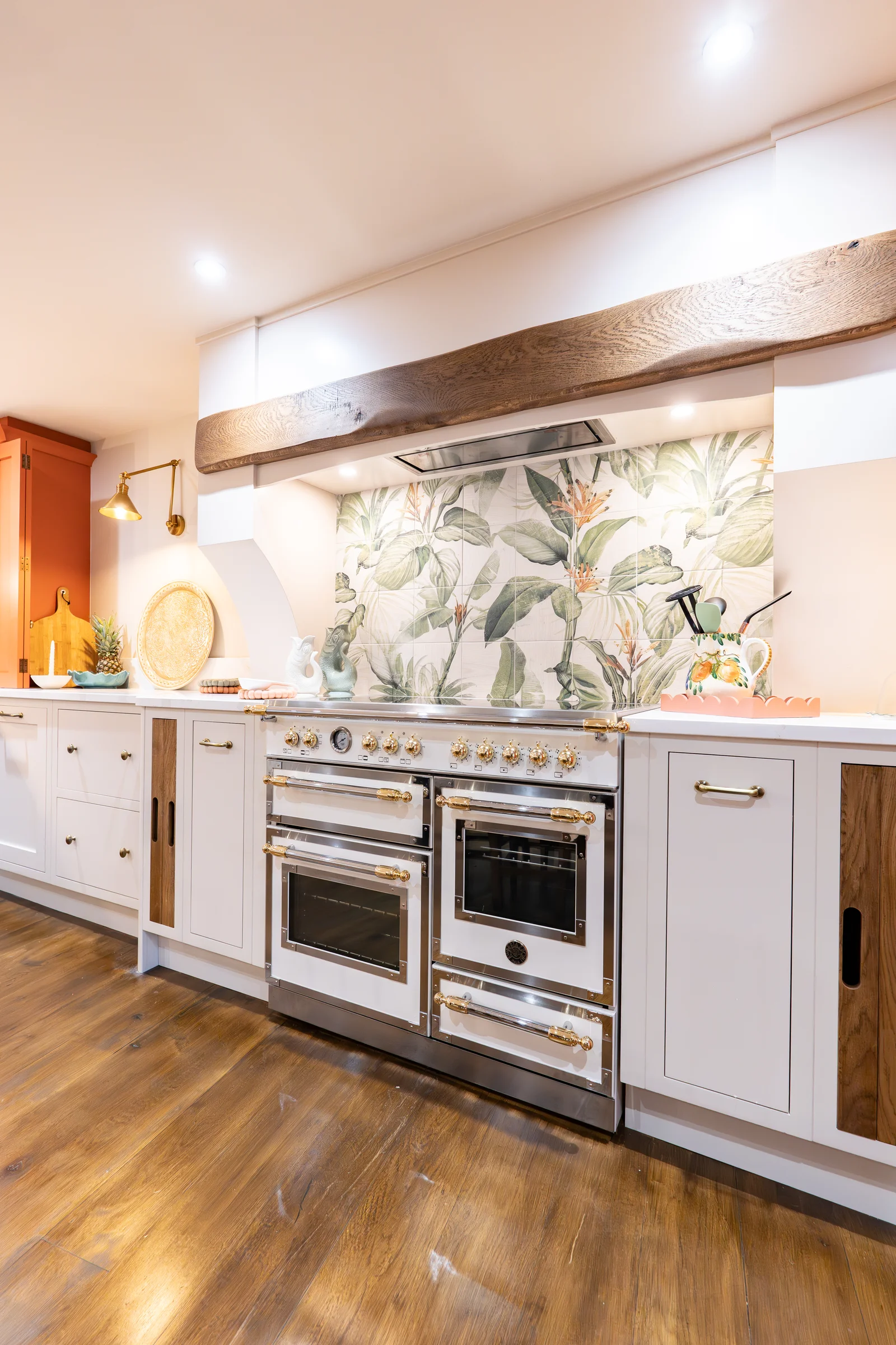 Bertazzoni range cooker botanical splashback tiles beam white shaker walnut end panel brass