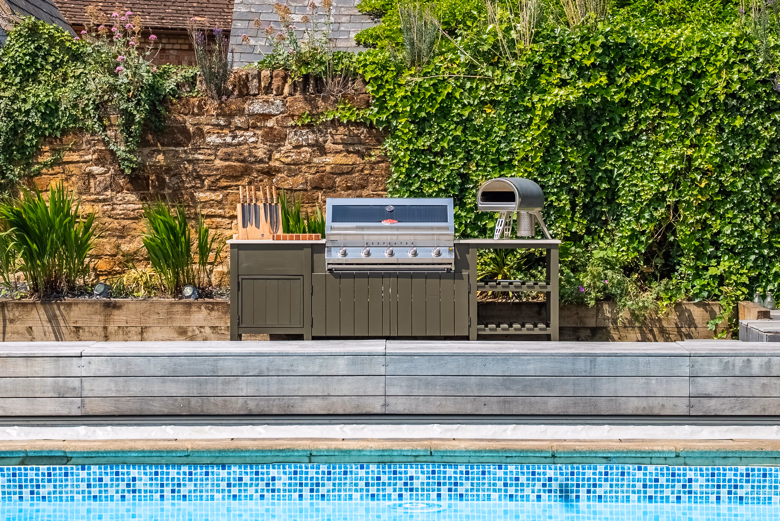 Alfresco one full kitchen poolside stone wall